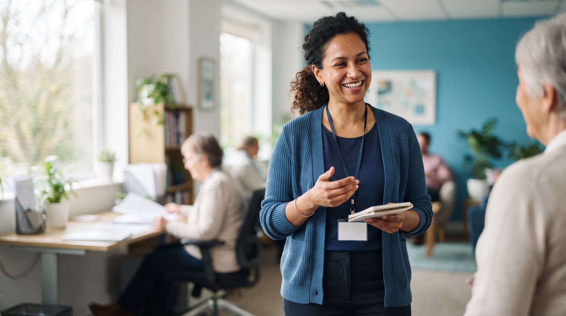 A support worker and client sharing a warm conversation